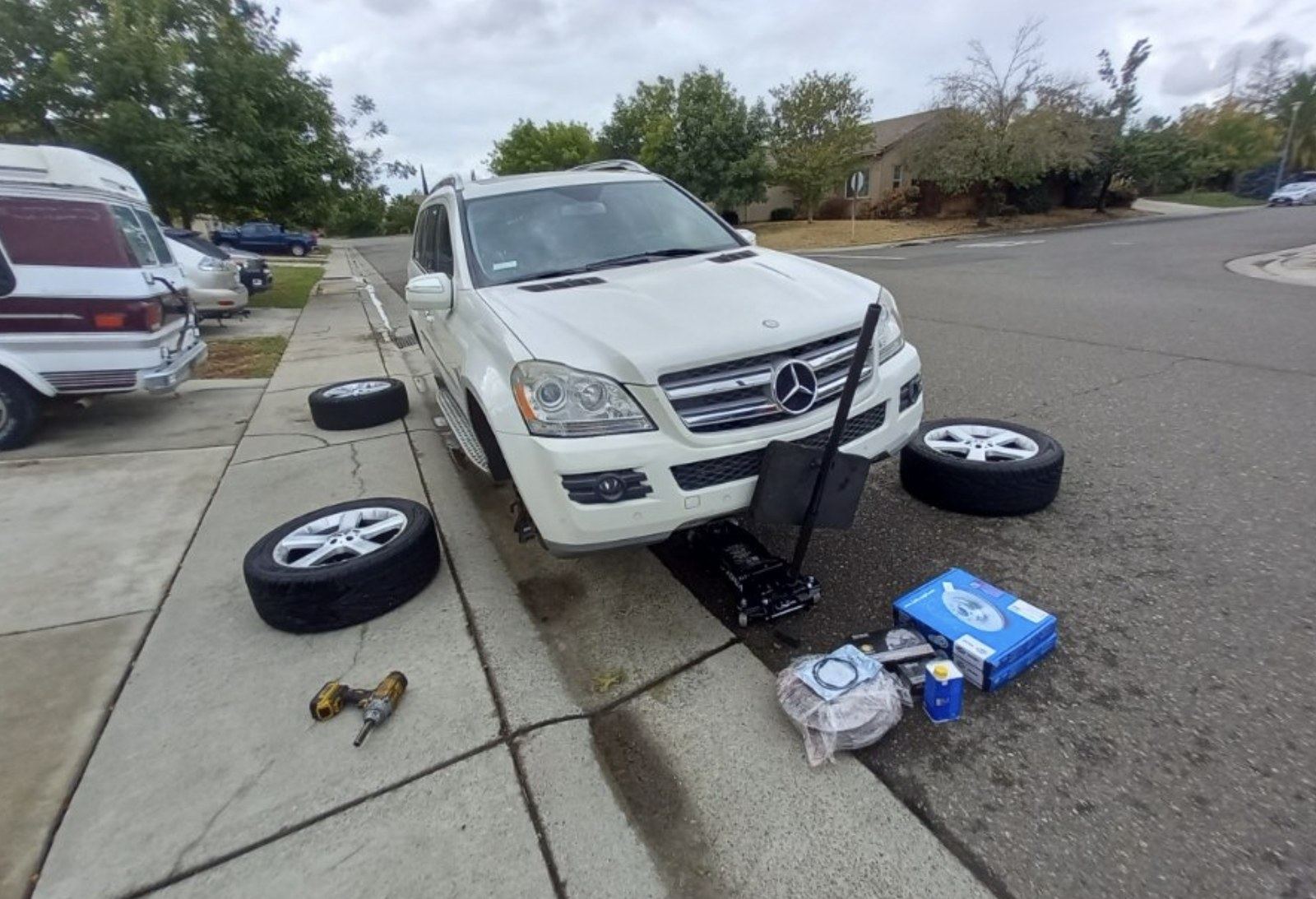 Street-side brake job underway on an El Paso block